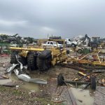 Damaged equipment sits on a farm struck by Wednesday night's tornado on Thursday, April 3, 2025, in Lake City, Ark. (AP Photo/Adrian Sainz)